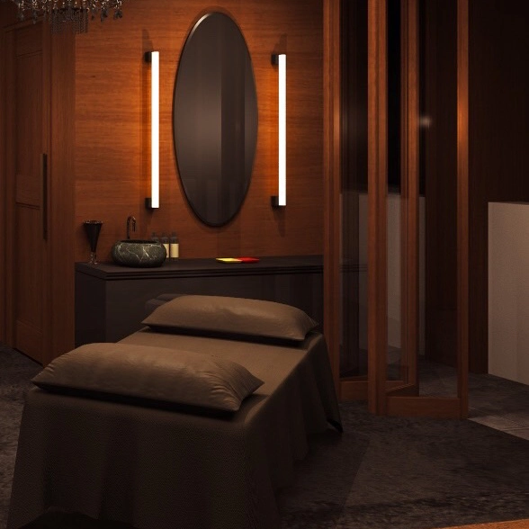 Luxurious spa treatment room with massage bed and elegant decor